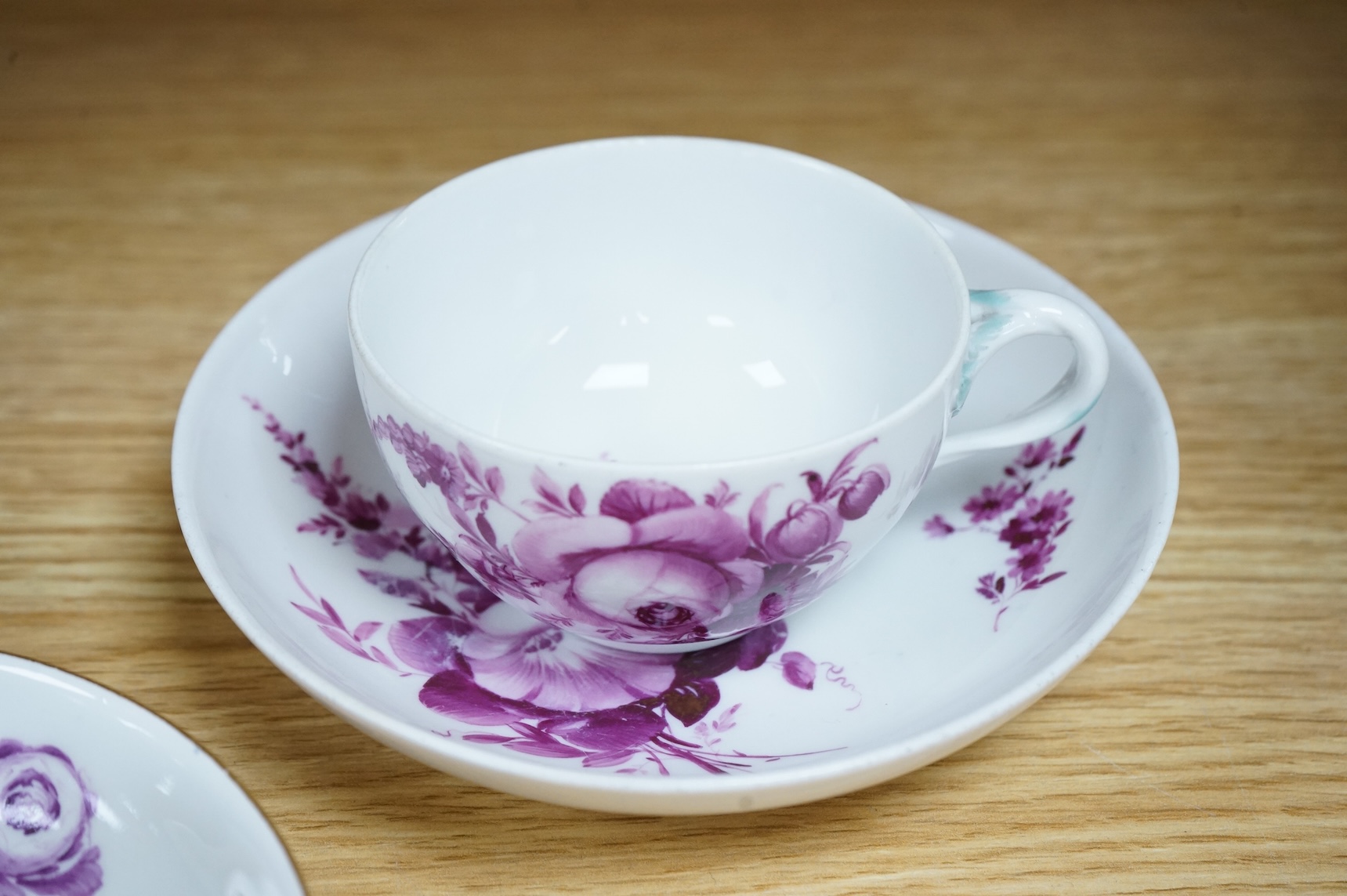 Two 18th century Meissen floral decorated teacups and saucers, largest saucer 13.5cm diameter